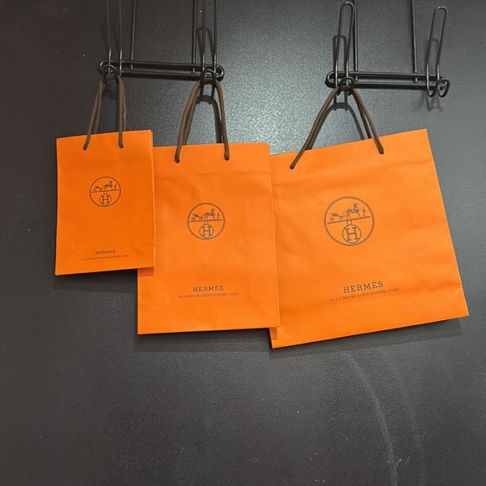 Authentic Hermes orange shopping gift bags (3) and Diptyque bags (1) bundle